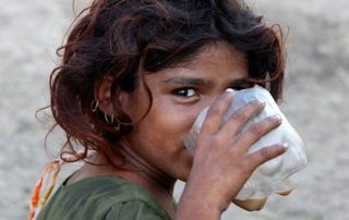Girl smiling drinking water